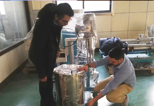 Customers inspect their machine